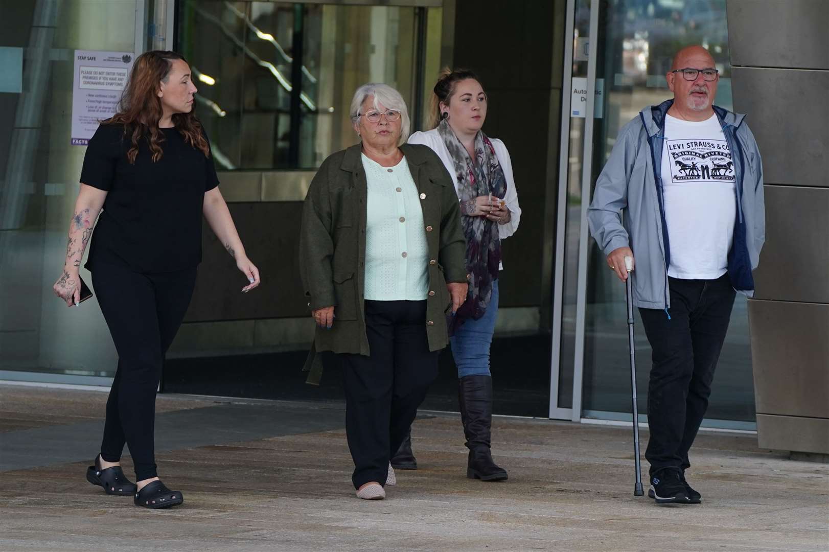 Amber Gibson’s foster parents, Carol Niven, second left, and Craig Niven, right, outside the High Court in Livingston (Andrew Milligan/PA)