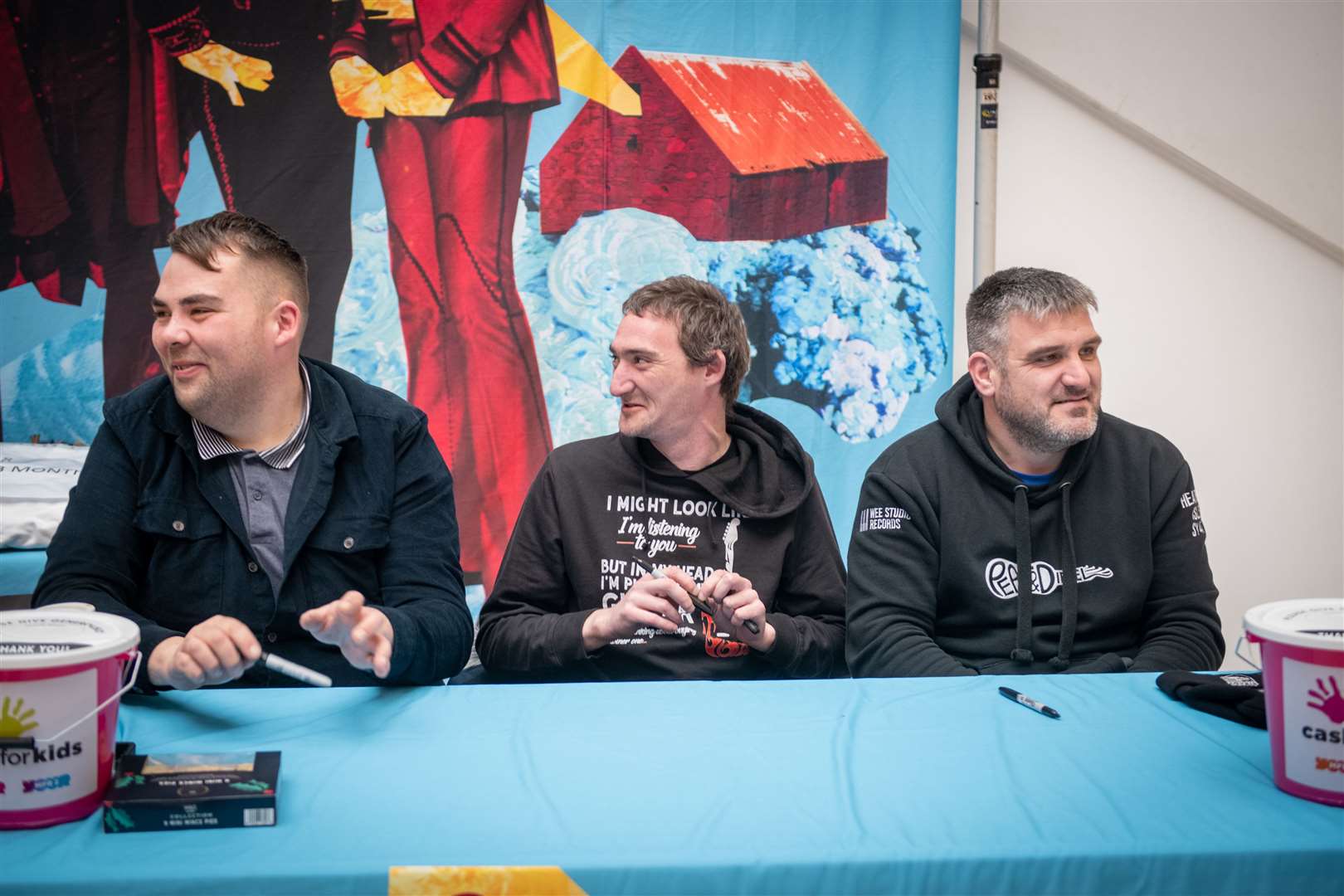 Peat & Diesel – from left – Ully, Boydie and Innes get to meet fans in the Eastgate Centre on Sunday after their free outdoor gig. Picture: Callum MackayP