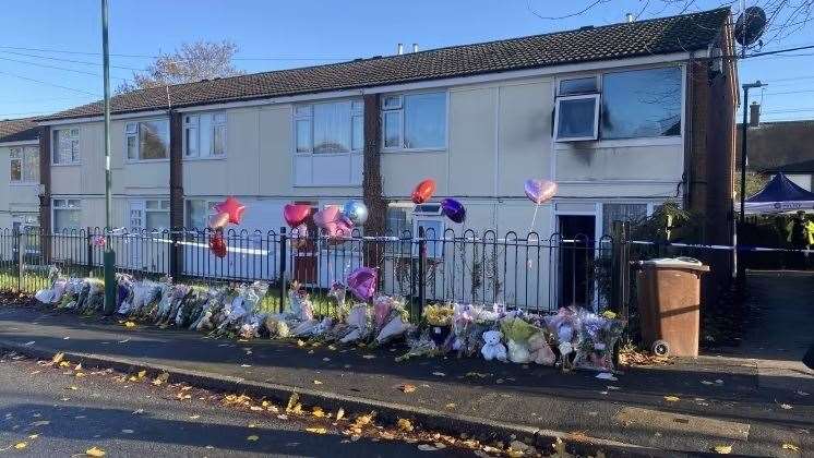 Tributes outside the flat in Clifton, Nottingham, which was the scene of the deadly fire (Nottinghamshire Police/PA)