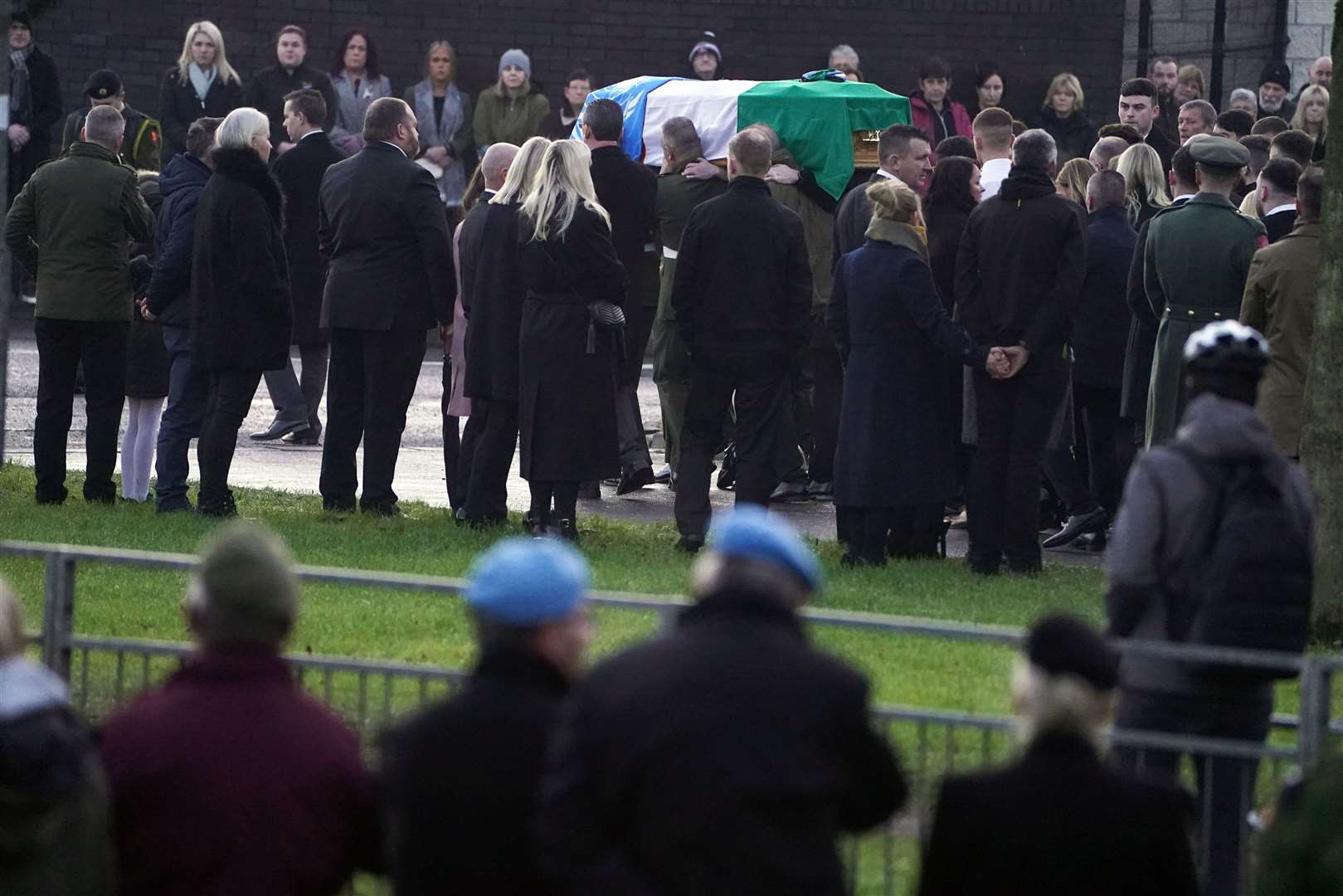 The coffin of Private Sean Rooney is carried into Holy Family Church (Brian Lawless/PA)