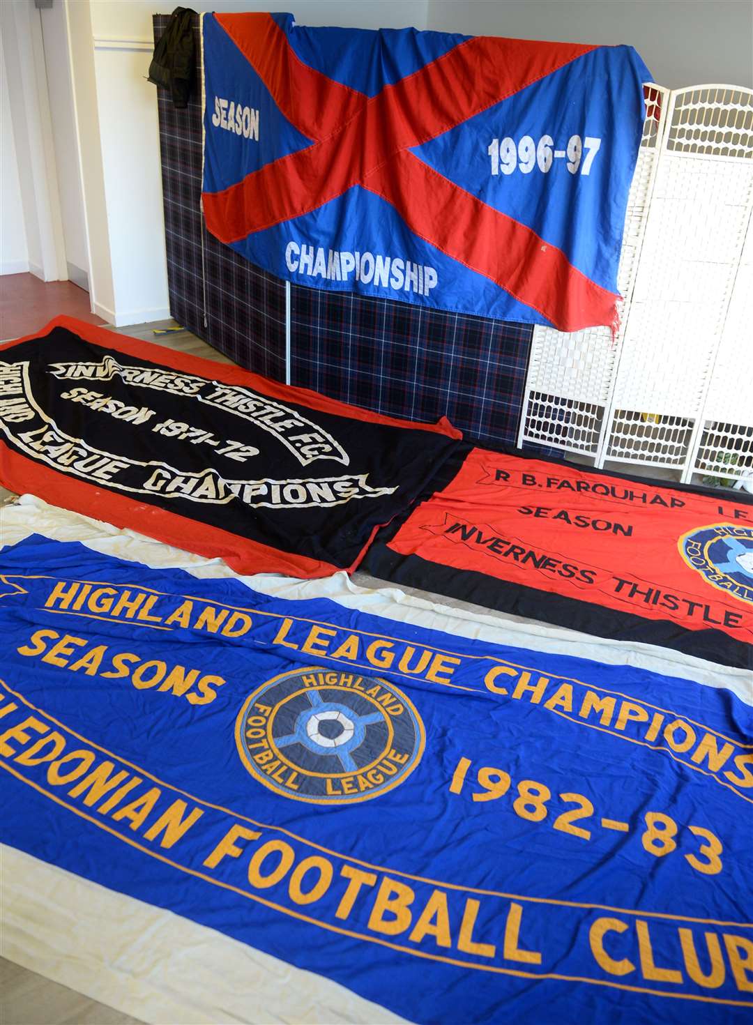 Championship winning flags are displayed at the launch of the Inverness Football Memories project.