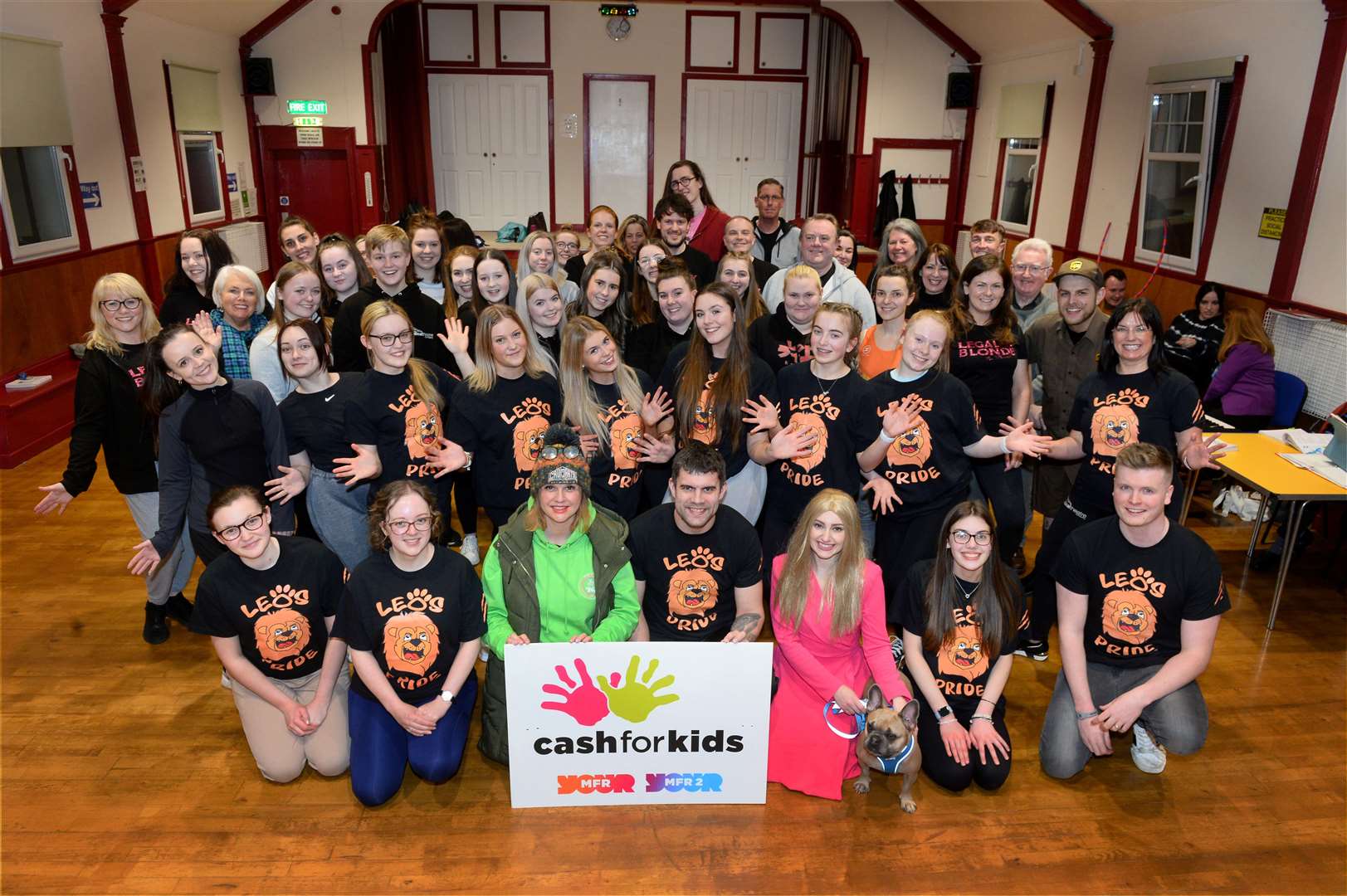 The cast of Inverness Musical Theatre's Legally Blonde production with supporters of MFR Cash for Kids.