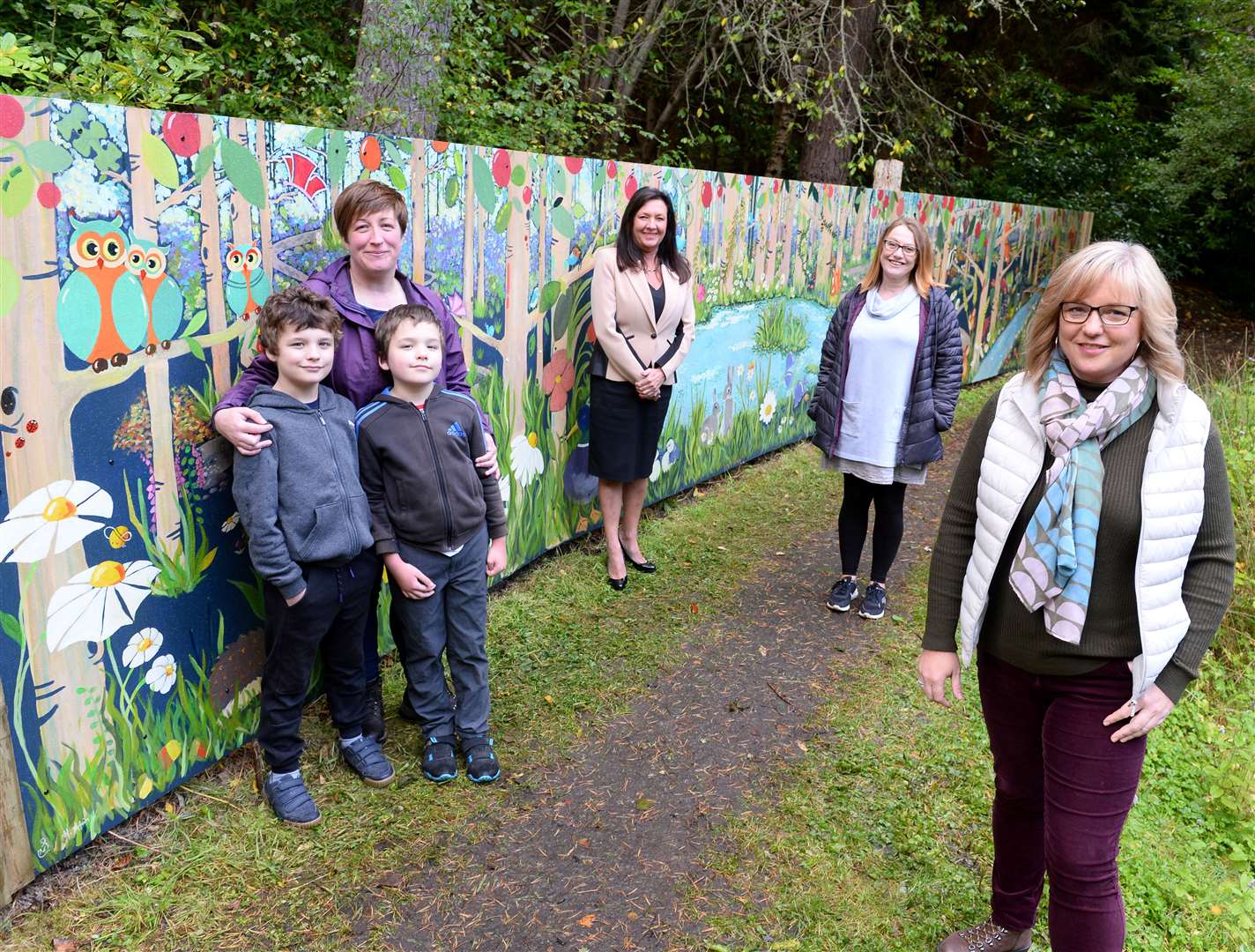 From left: Debbie, Jamie and Craig Borthwick of Dunain Community Wood, Jacqui McPherson of Robertson Homes, and artists Heather Afrin and Susan McCreevy. Picture: Gary Anthony