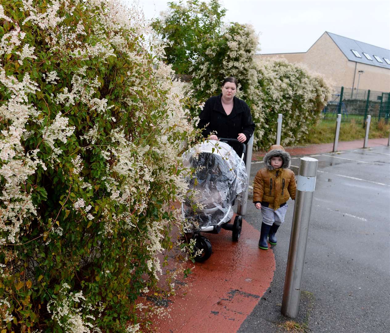 vandalism around Benula play area..Donna Chinskie and children Sean and Sharlotte at the overgrown path to Merkinch Primary..Picture: Gary Anthony..