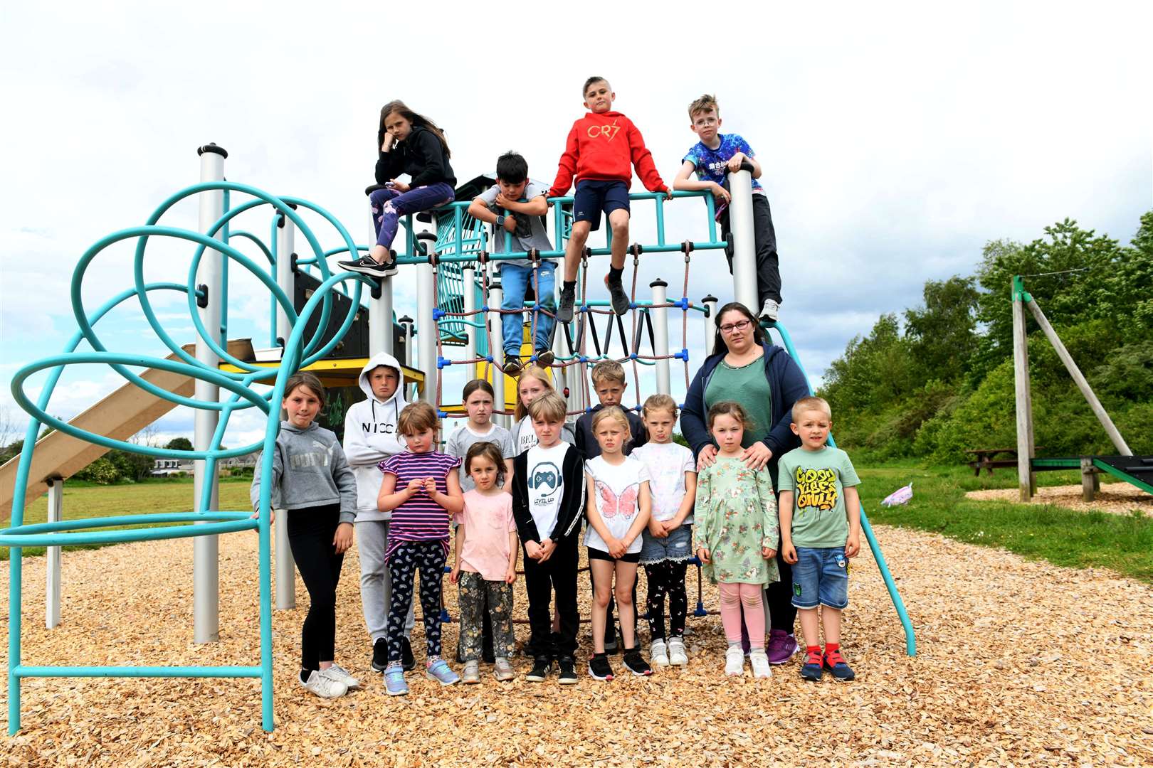Karyne Walker with some of the children who use the play park. Picture: Callum Mackay