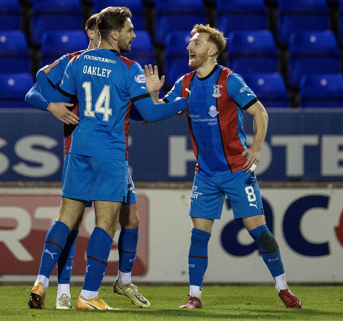 David Carson (right) celebrates with George Oakley and Nathan Shaw (hidden) after the latter’s late equaliser against Ayr. Picture: Ken Macpherson