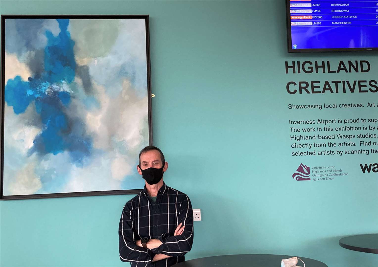 Artist Martin Irish with one of his exhibits at Inverness Airport.