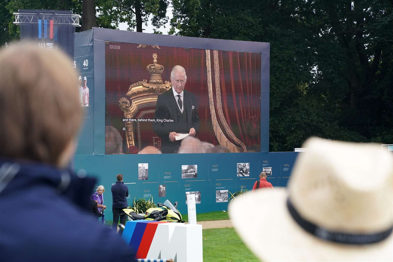 The ceremony was watched around the country, with golf spectators at the PGA Championship at Wentworth Golf Club able to view it on the big screens around the course (Adam Davy/PA)