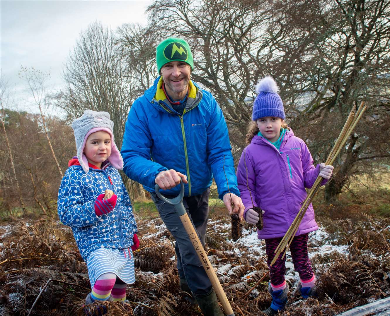 Freya, Nick and Lily Carter doing their bit for the woodland.