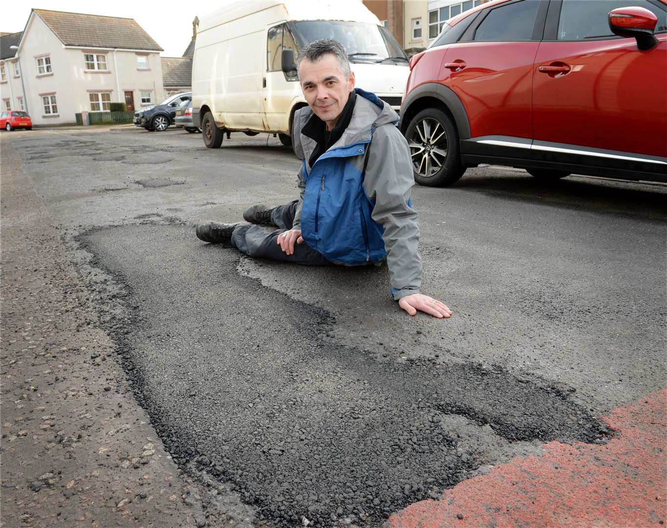Potholes,.Gary Livingstone at repaired potholes on Dunabban Road..Picture: Gary Anthony. Image No..