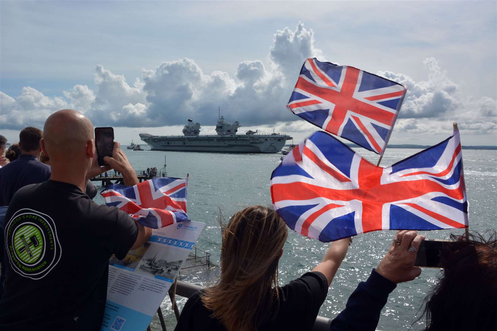Families and well-wishers wave off HMS Prince of Wales as it leaves Portsmouth Naval Base for exercises off the coast of the US (Ben Mitchell/PA)