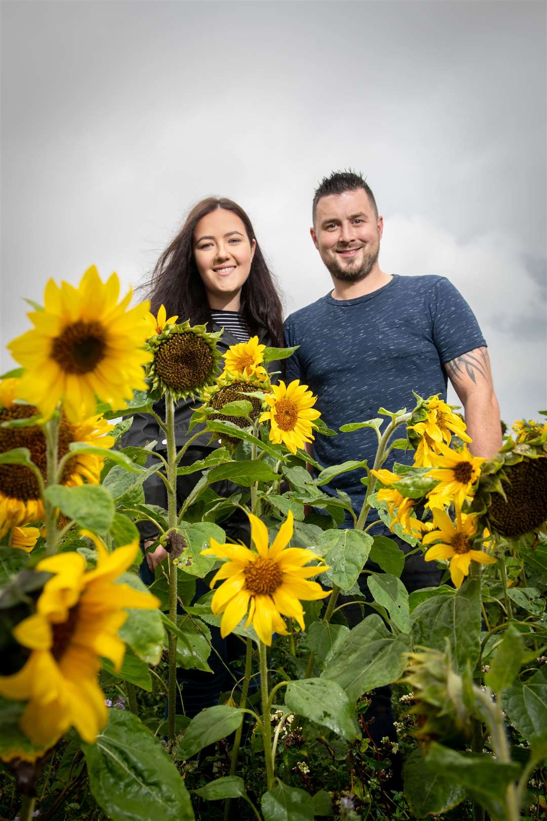Robert Craigie and his fiance Lucy Barclay have been growing sunflowers for three local charities. Picture: Callum Mackay