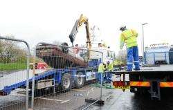 The Vauxhall Cavalier after it was pulled from the canal this morning.