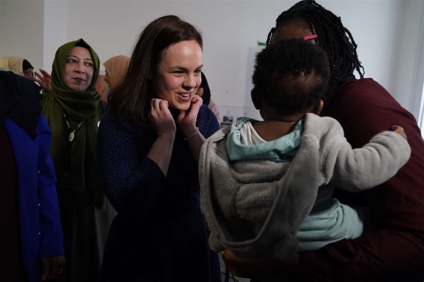 SNP leadership candidate Kate Forbes met families during a visit to the Empower Women for Change organisation in Glasgow (Andrew Milligan/PA)