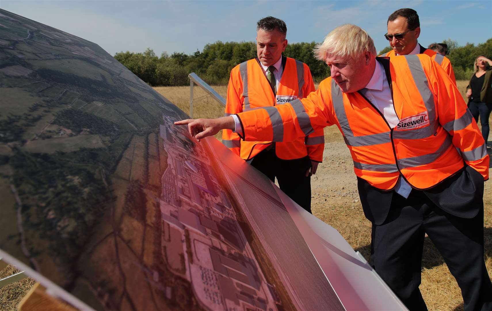 Boris Johnson looks at plans for the Sizewell C nuclear power station project (Chris Radburn/PA)