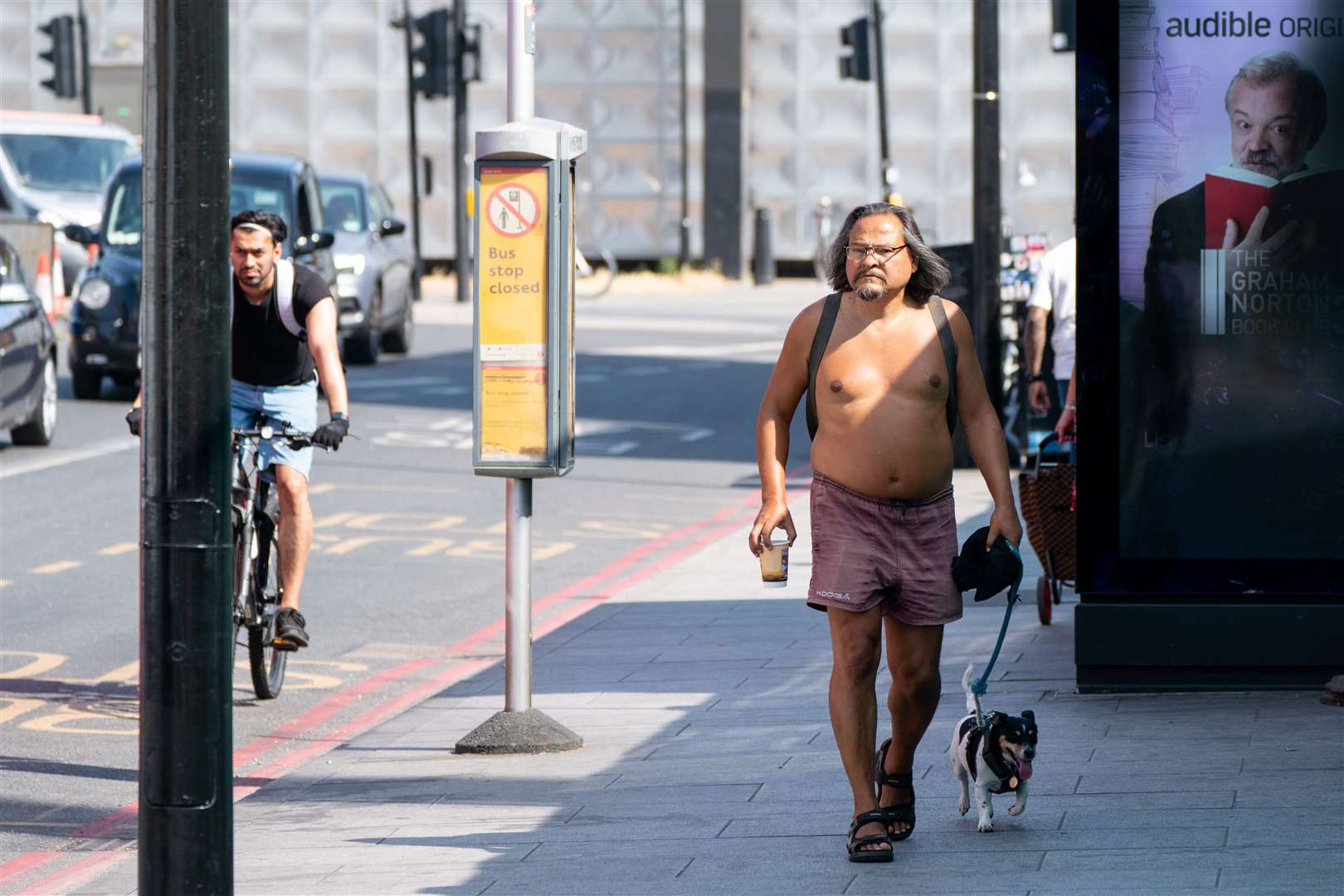 A man walks his dog in central London (Dominic Lipinski/PA)