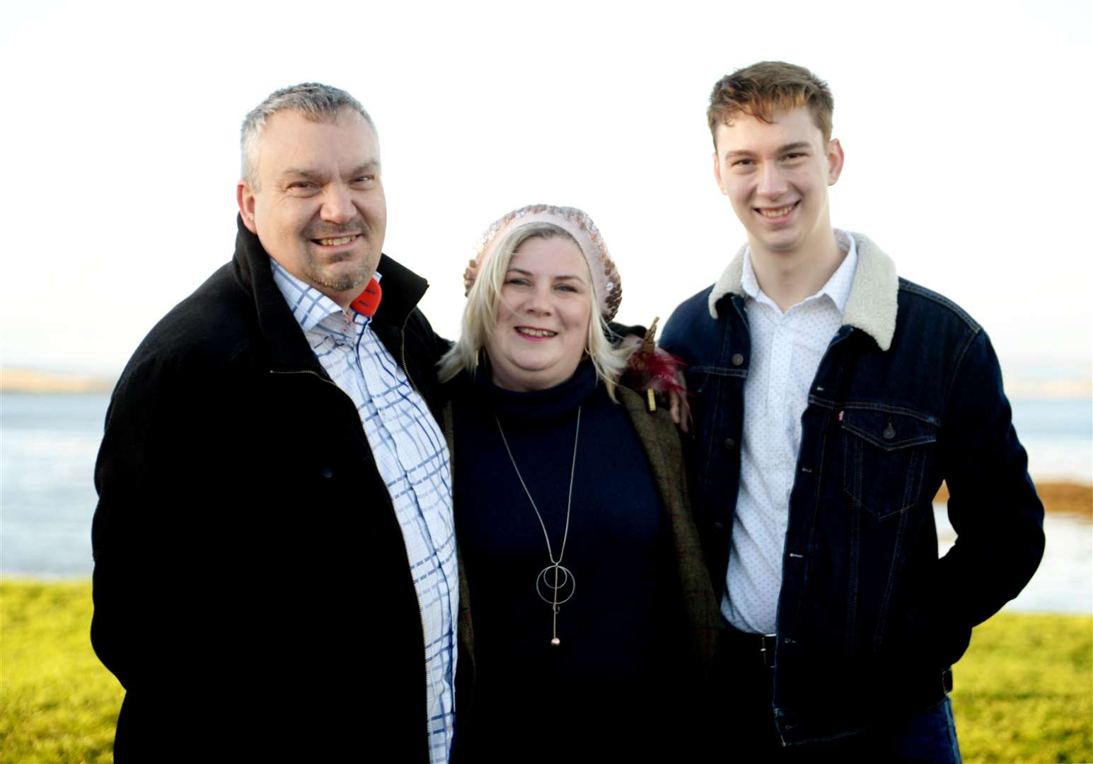 Ross Halkett with his parents, Robbie and Karen.