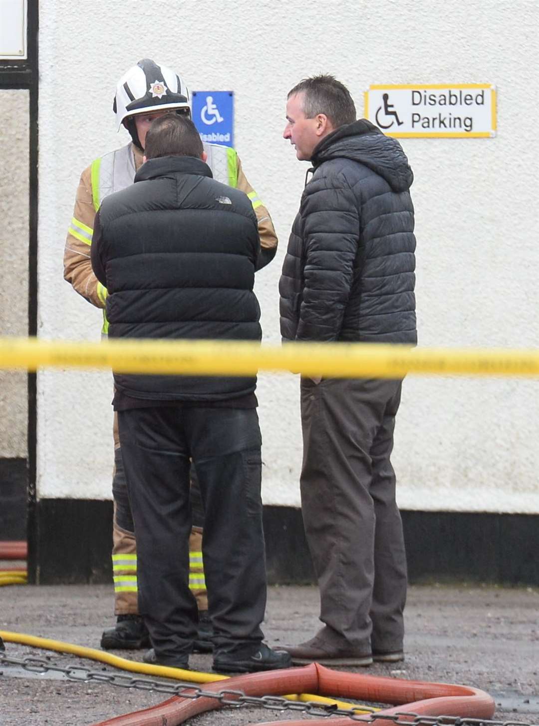 Clachnacuddin chairman Alex Chisholm (right) talks with the emergency services. Picture: Gary Anthony.