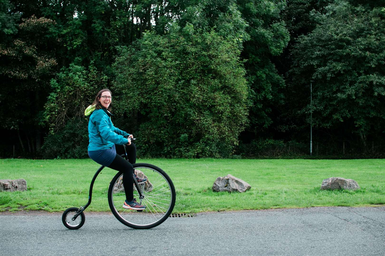 Katie Noble riding a penny farthing.