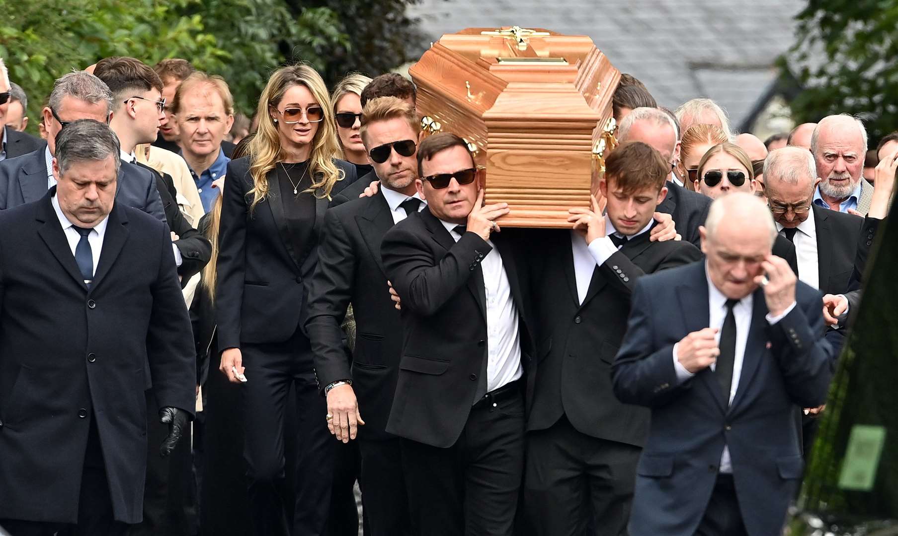 Ronan Keating helps carry the coffin of his brother Ciaran (Ollie McVeigh/PA)