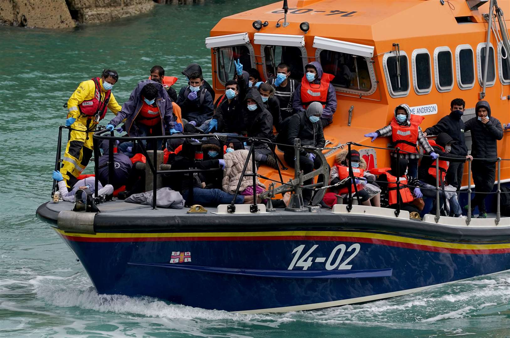 A group of people thought to be migrants are brought in to Dover, Kent, onboard a lifeboat (Gareth Fuller/PA)