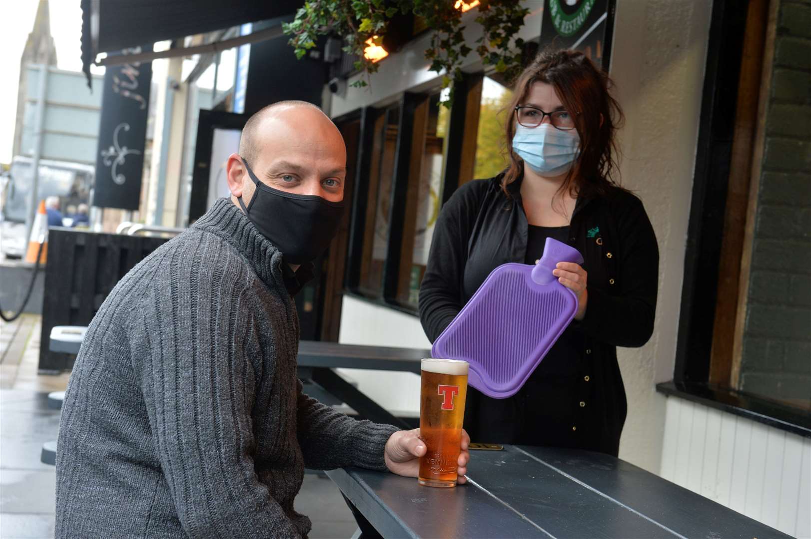Wes Taylor-Marriott and Lucy MacGillvray at Johnny Foxes, which ws giving out hot water bottles to customers.