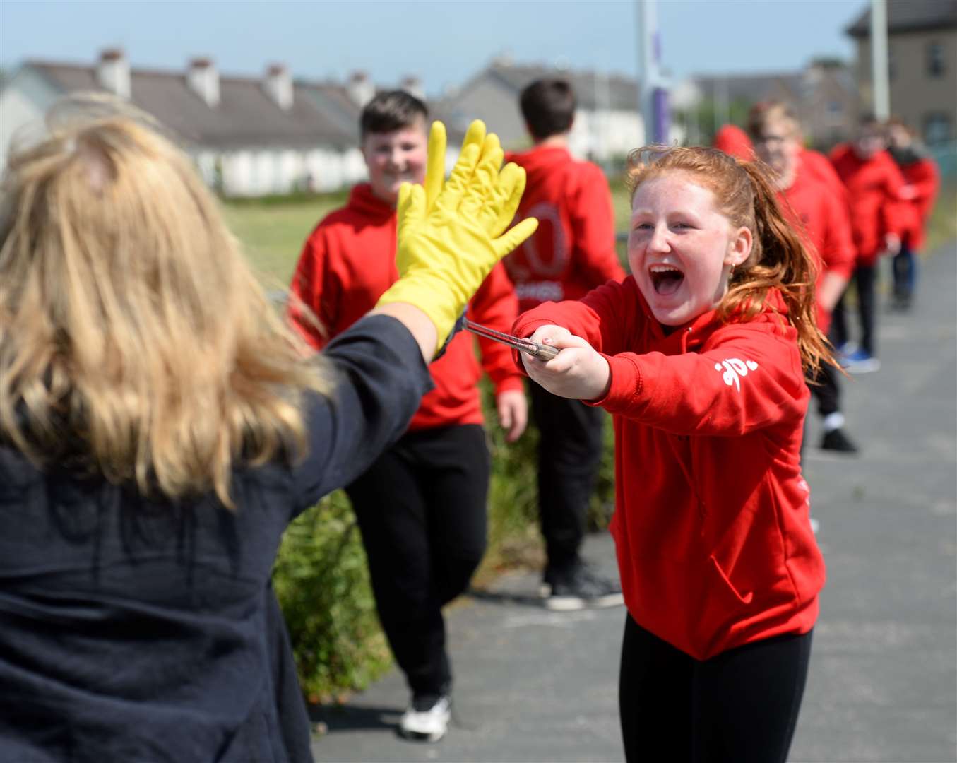 Brooke Hunter gave a socially distanced high five to head teacher Rhona MacCormick at a graduation ceremony for P7s at Dalneigh Primary.