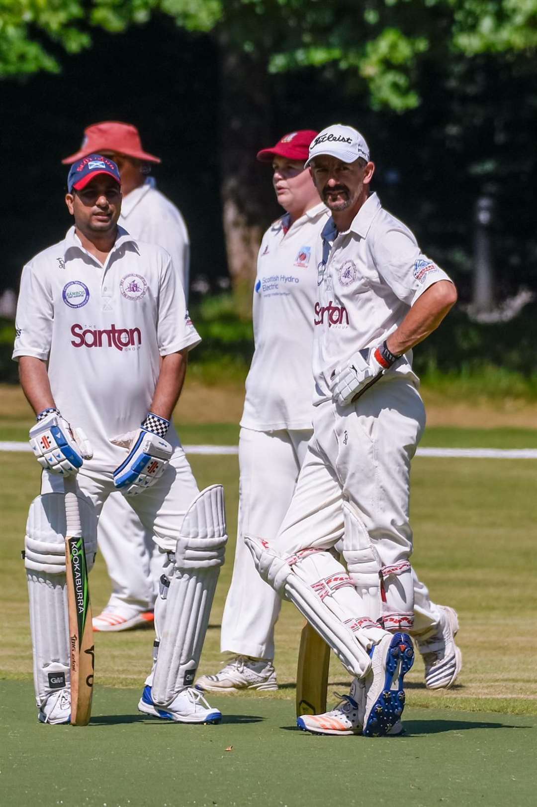 Fort Augustus Cricket Club players Ross Lavin and Ash Anjum chat between overs.