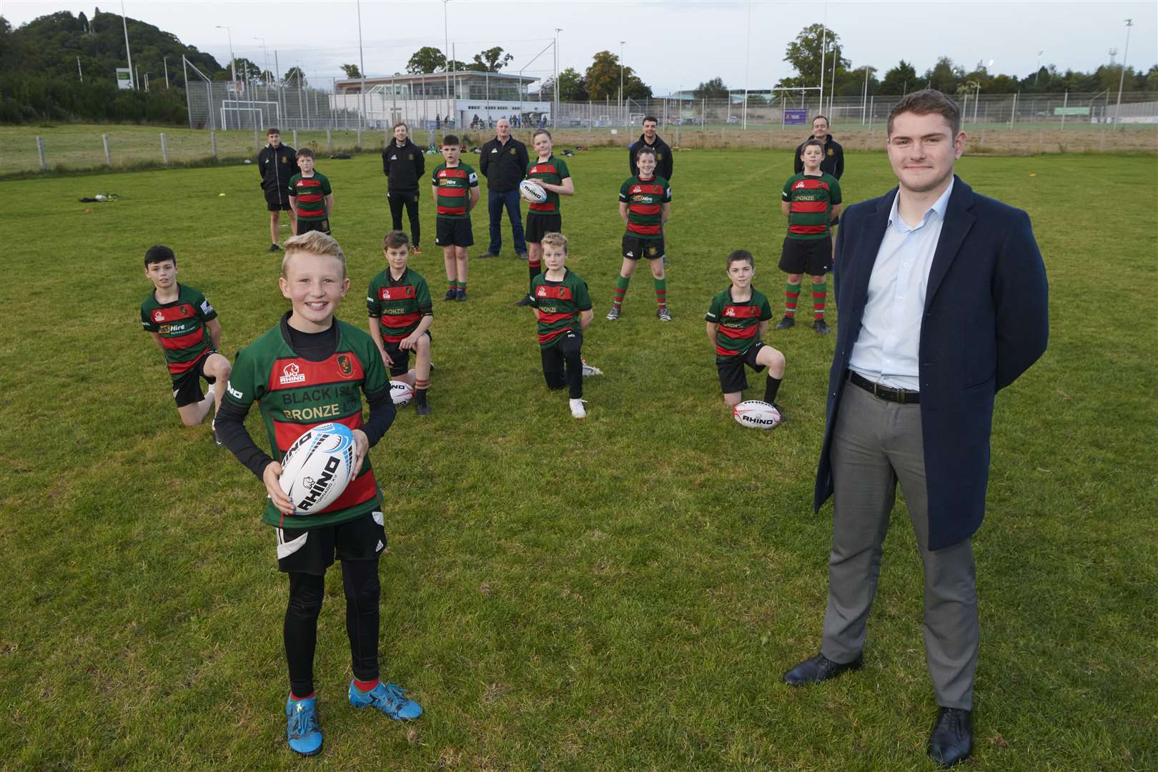 Aldi and Highland Rugby Club sponsorship. LtoR Graham Findlater, President HRC, Neil Malcolm, Aldi and Brian Knowles, Lead Coach Watching the U-13 training session. Front of photo Lachie Sangster (11) and Neil Malcom of Aldi.