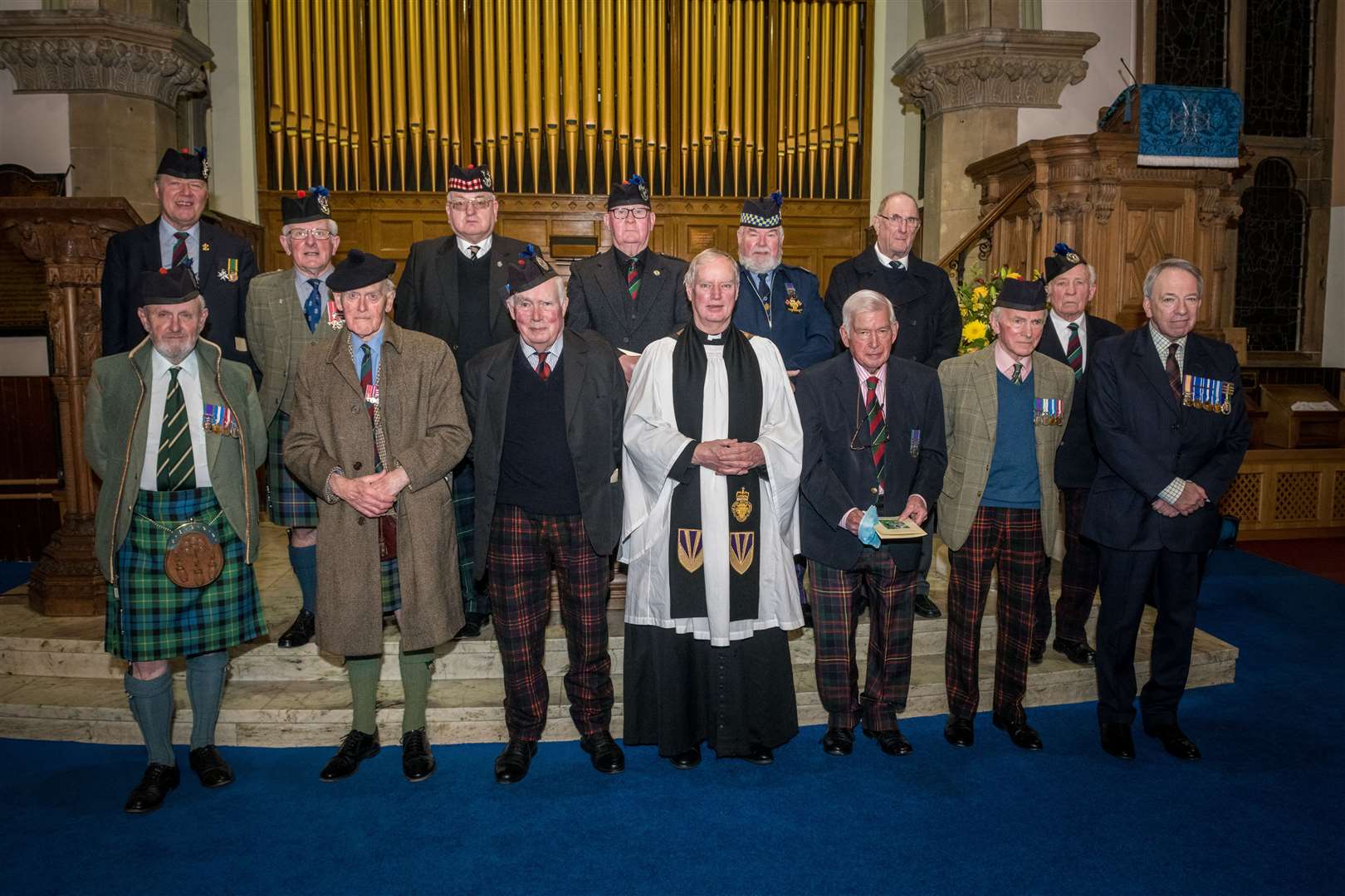 Padre Dr Canon John Cuthbert (centre) with veterans from the Queen’s Own Highlanders (Seaforth & Camerons).