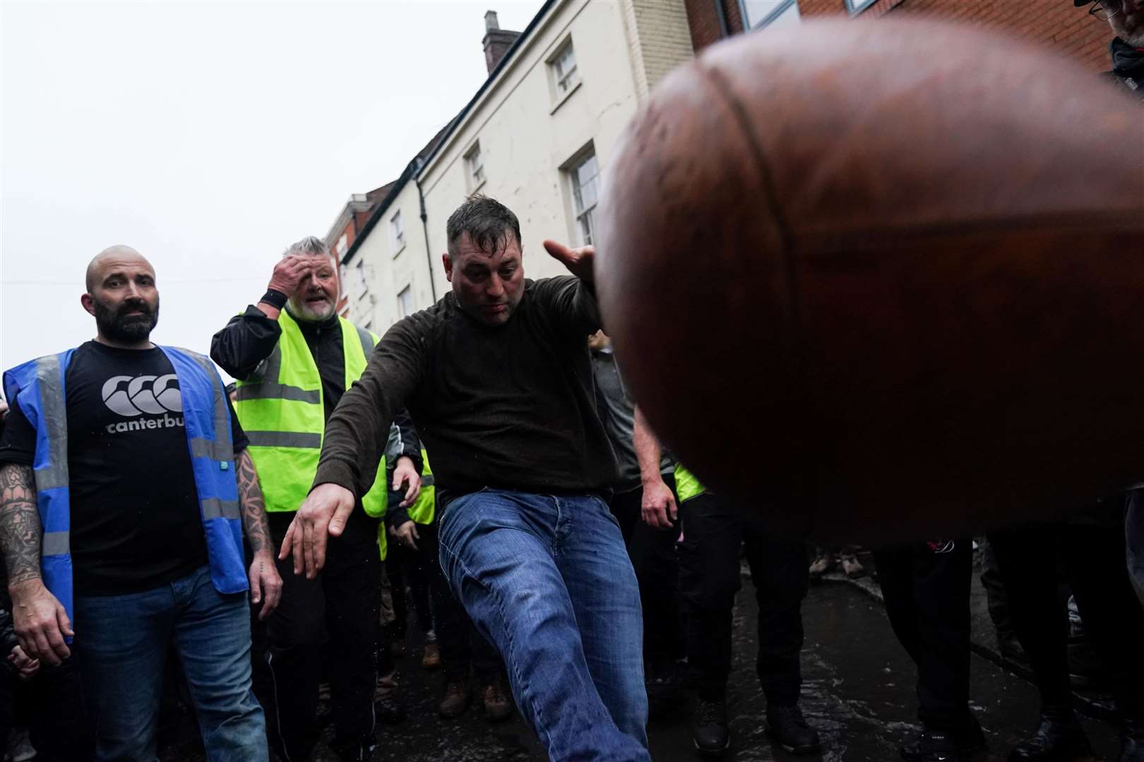 One man was seen enthusiastically kicking the ball (Jacob King/PA)