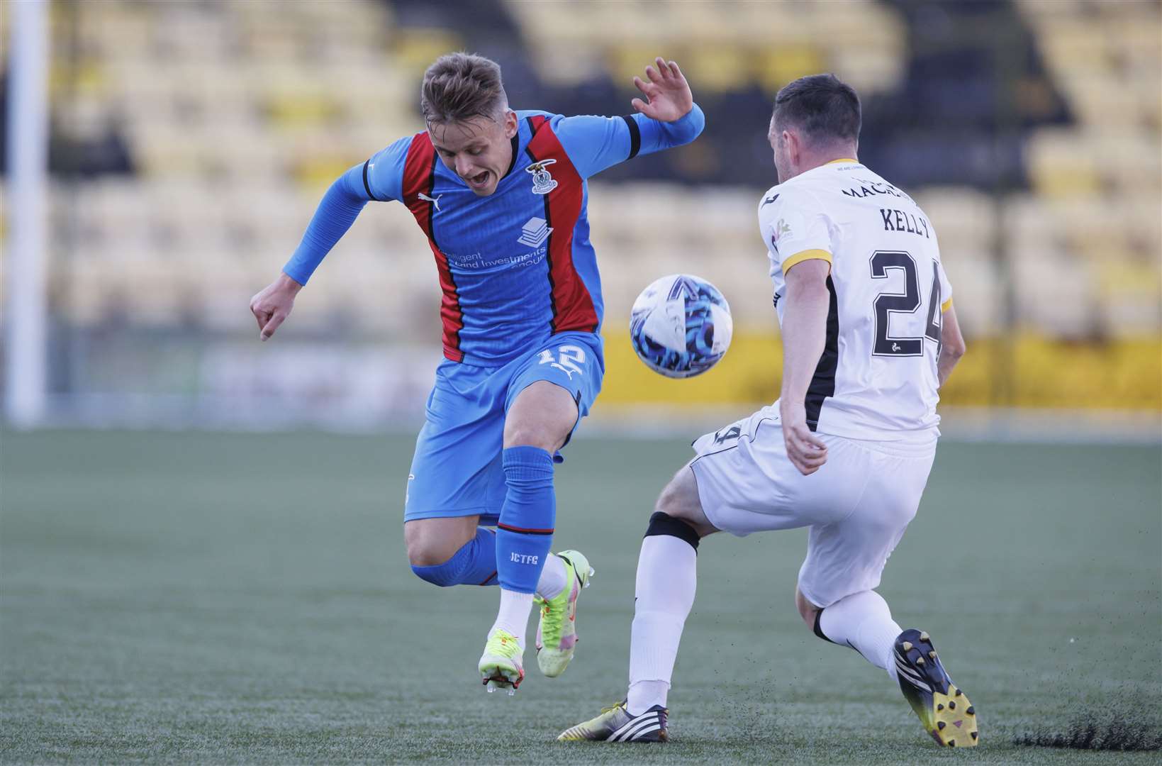 Picture by Steve Welsh. 12 July 2022 Livingston v Inverness Caley Thistle Roddy MacGregor jumps clear of Sean Kelly