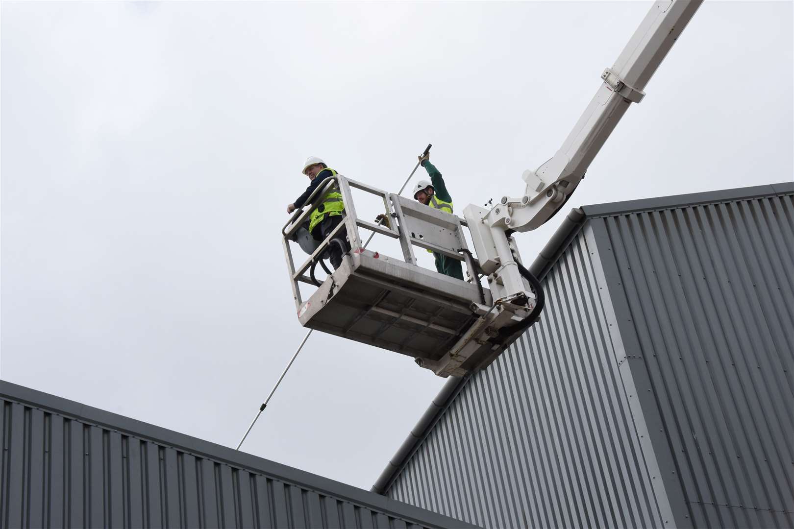 A pest control technician swoops on an Inverness roof.