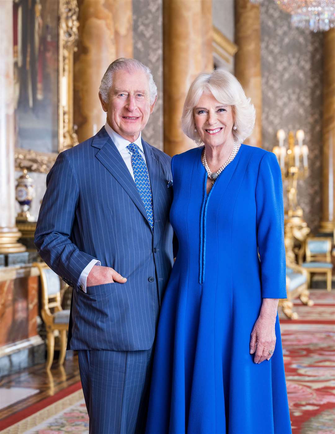 The King and Queen Consort in the Blue Drawing Room at Buckingham Palace in 2023 (Hugo Burnand/PA)