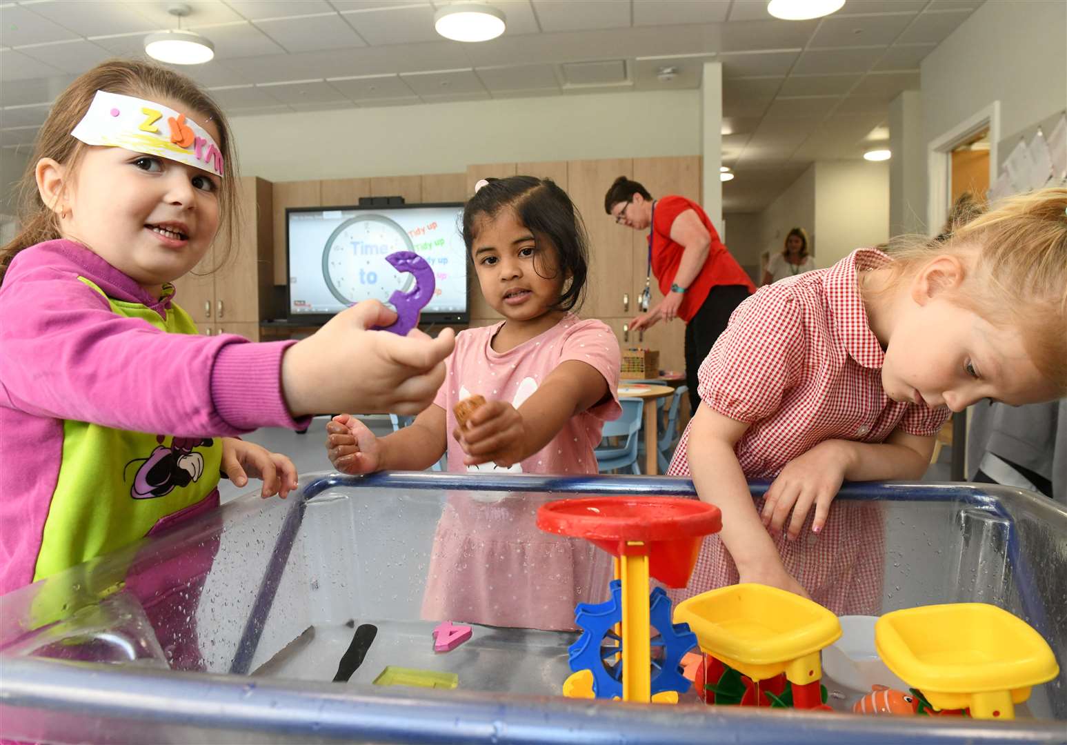 Bianca Chicote Ben, Isabella Marshall and Zaima Raya have fun in Crown Primary School's new nursery.