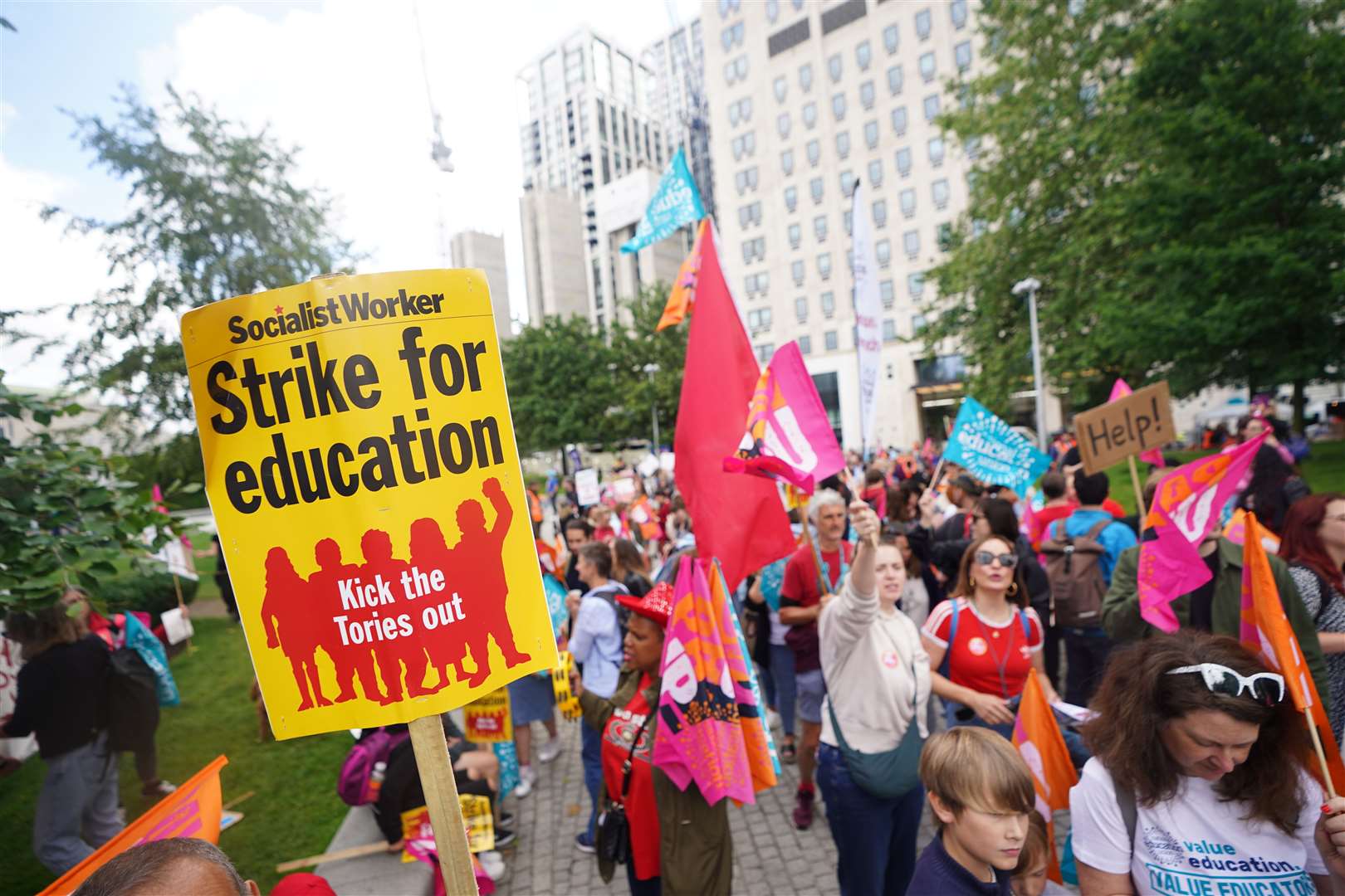 Members of the National Education Union take part in a rally through Westminster (James Manning/PA)
