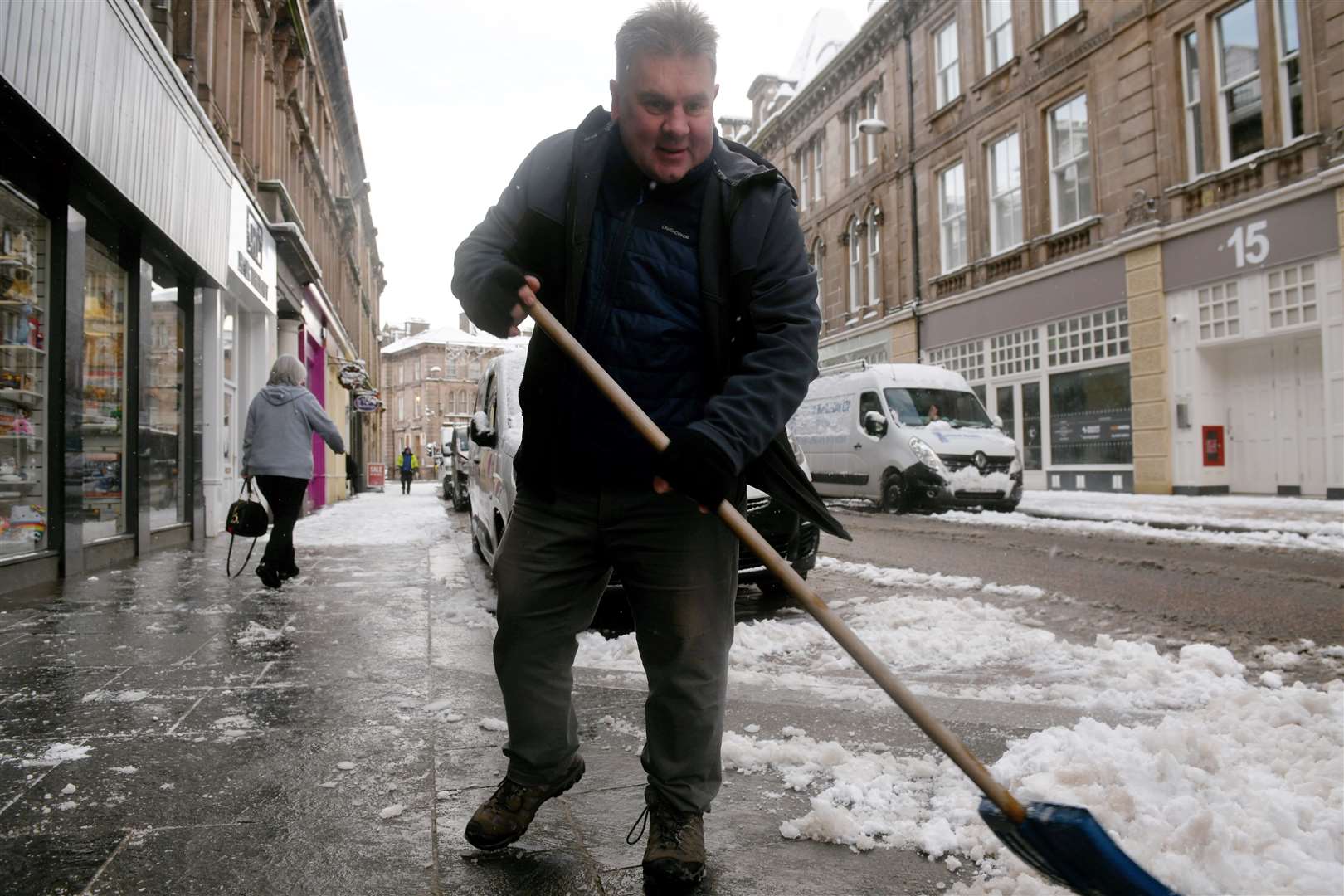 Shovelling the snow on Union Street. Picture: James Mackenzie