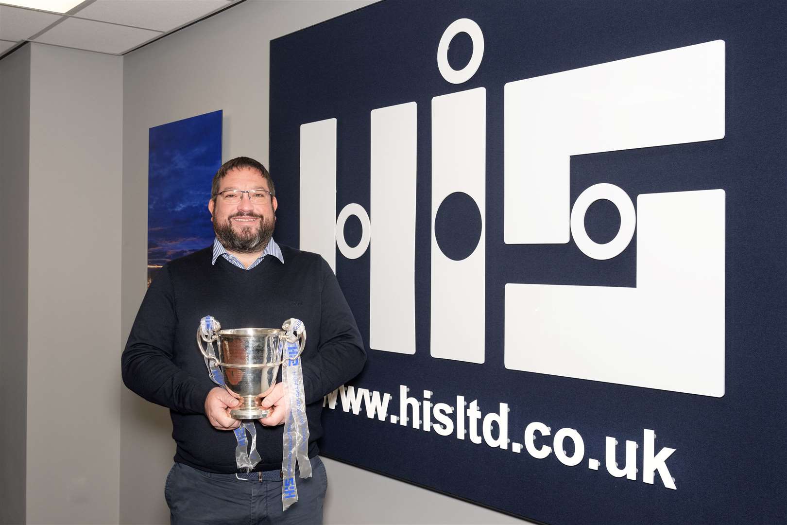 Highland Industrial Supplies director Garry Mackintosh with the Sutherland Cup. Picture: Neil Paterson