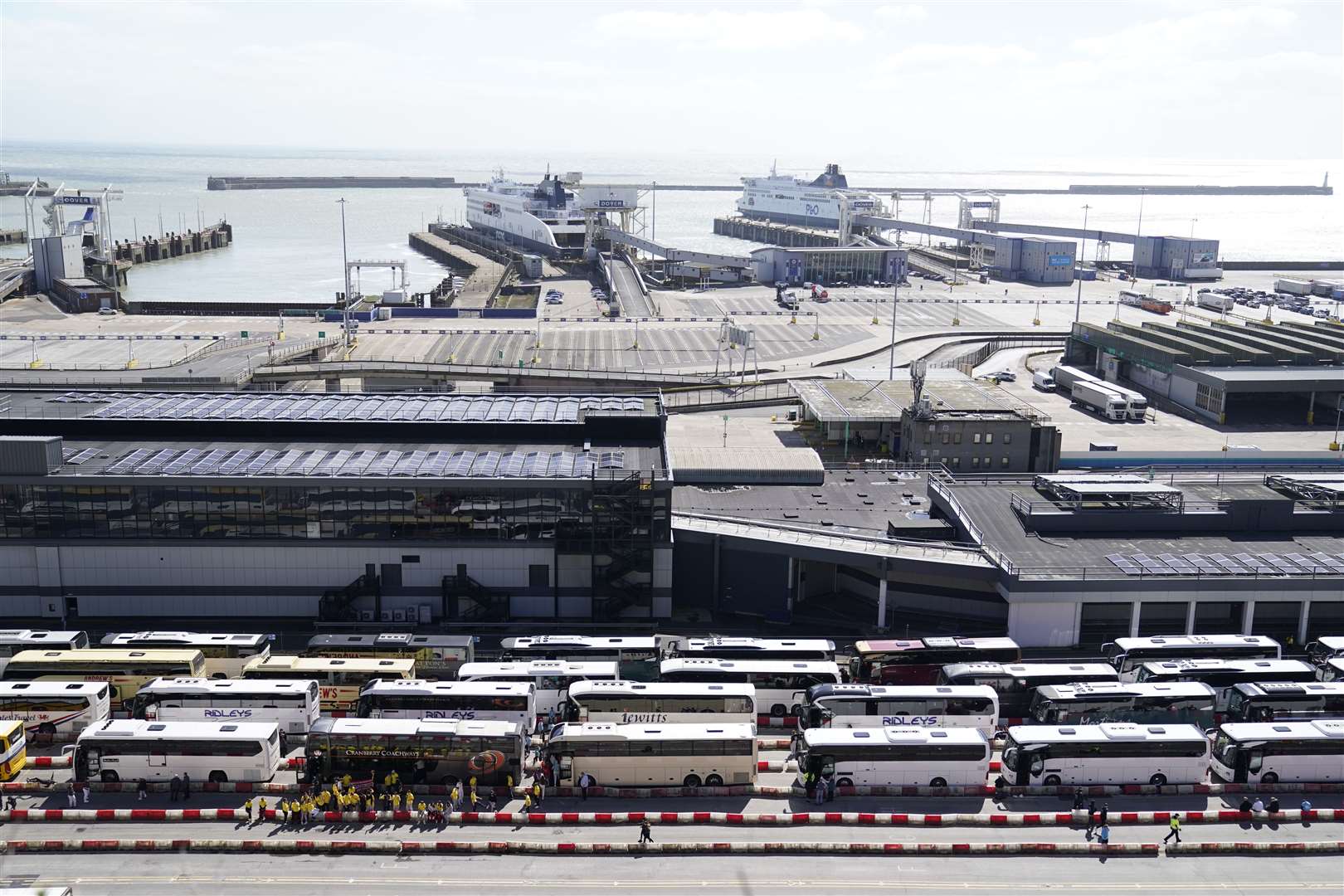 Coaches wait to enter the Port of Dover on Sunday (Andrew Matthews/PA)