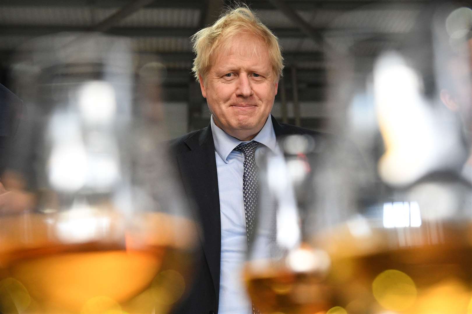 Prime Minister Boris Johnson tastes whisky at the Roseisle Distillery in Scotland near Moray at the start of the General Election campaign..