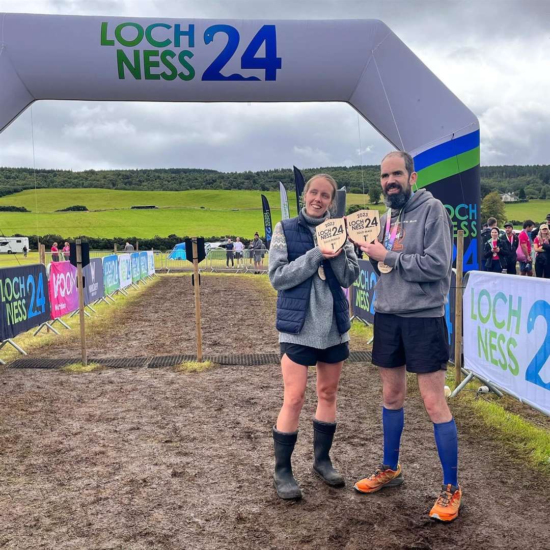 Male and female solo winners Rosie Doull and Iain Bethune. Rosie achieved 24 laps with a time of 21 hours 12 minutes and 03 seconds whle Iain completed 29 laps in 24.11:49. Picture: Loch Ness 24
