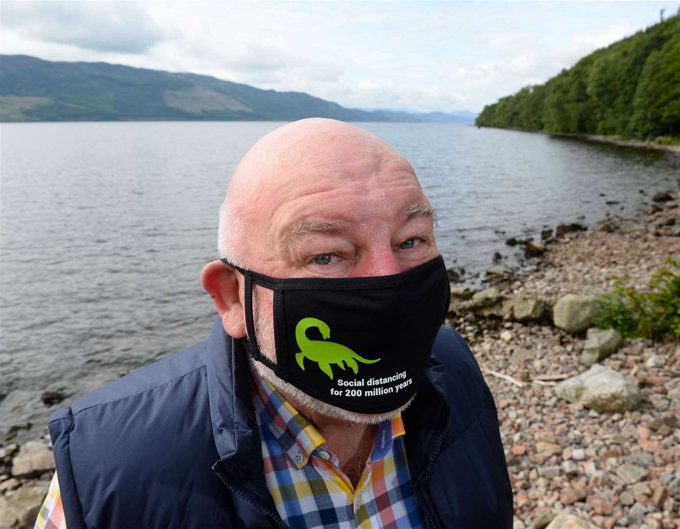 Willie Cameron with his Nessie facemask on banks of Loch Ness..Picture: Gary Anthony..