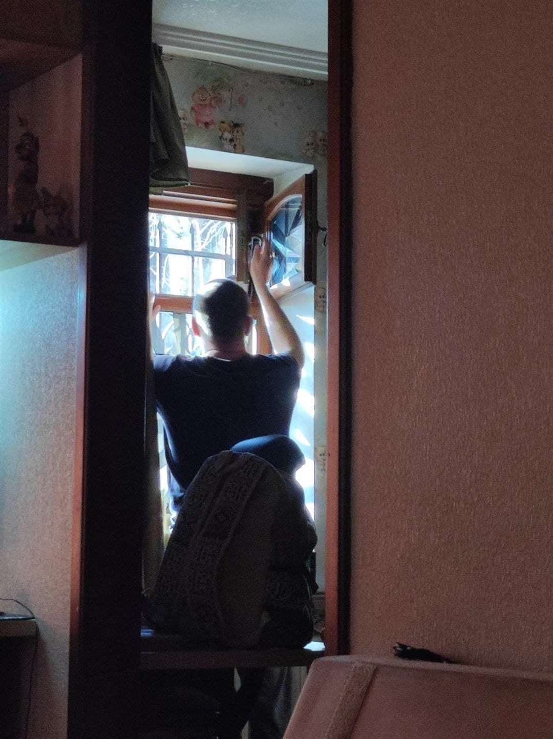Ms Proskurnina’s father has taped the home’s windows to prevent being hit by shattered glass (Anna Proskurnina/PA)