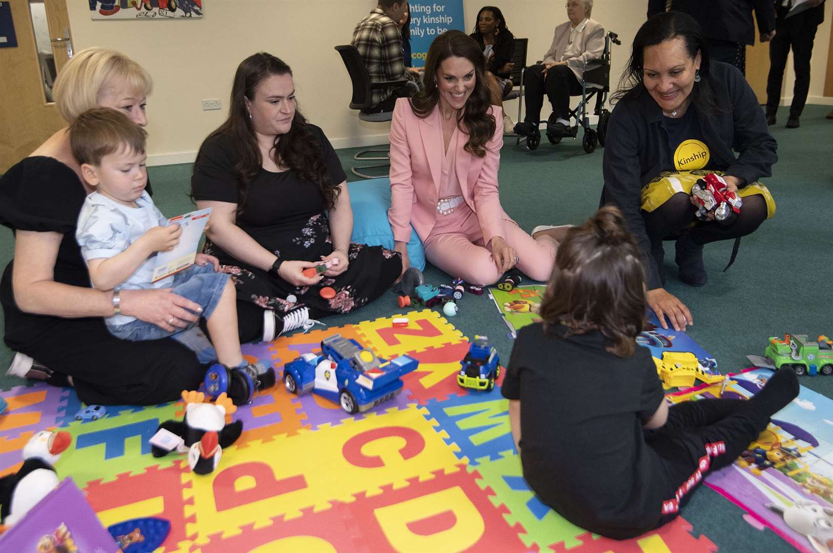 Kate played with some of the children in kinship care (Eddie Mulholland/Daily Telegraph/PA)
