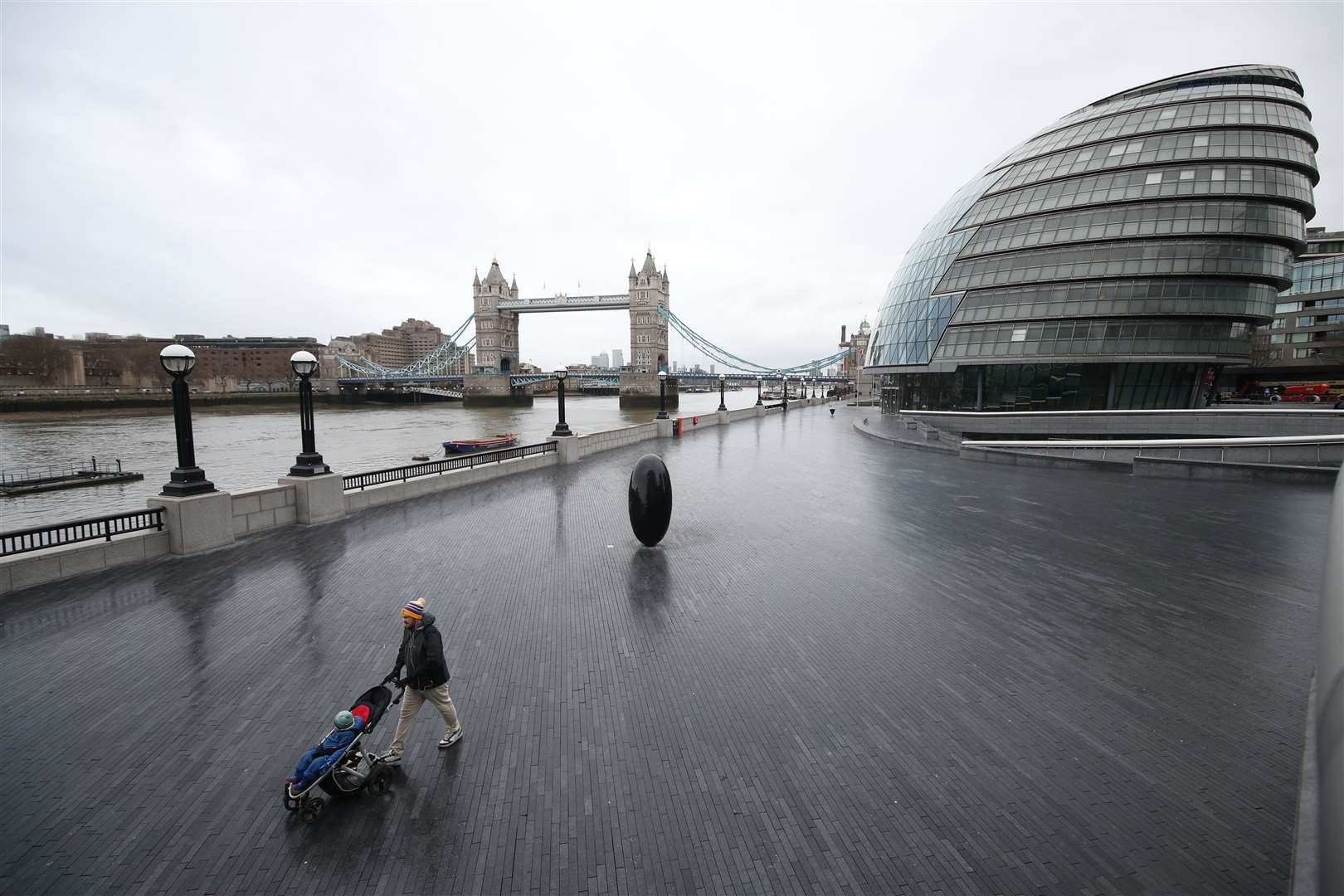 The riverside walk next to Tower Bridge in London was empty the morning after Prime Minister Boris Johnson set out lockdown measures for England (Yui Mok/PA)