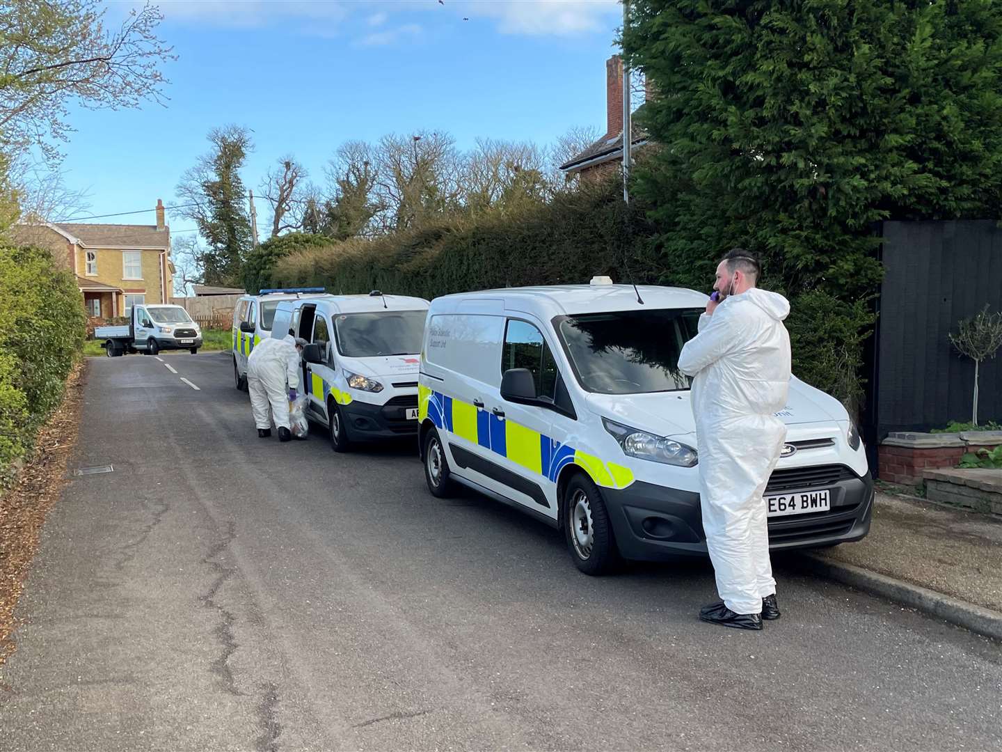 Police forensics officers in The Row in Sutton (Sam Russell/PA)