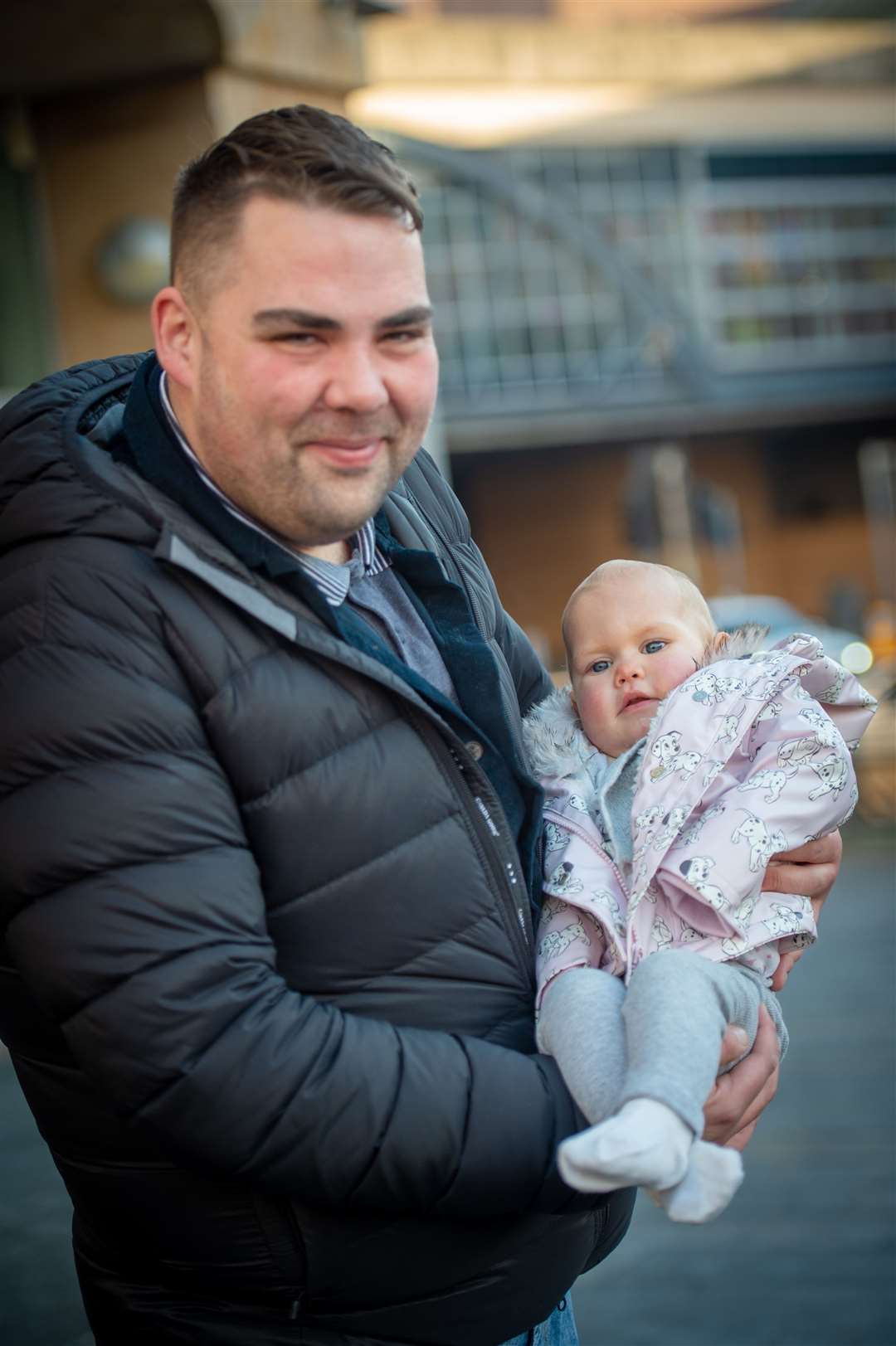 Peat & Diesel drummer Ully Macleod left holding baby Ava-Rose Taylor before the band's free set. Picture: Callum Mackay
