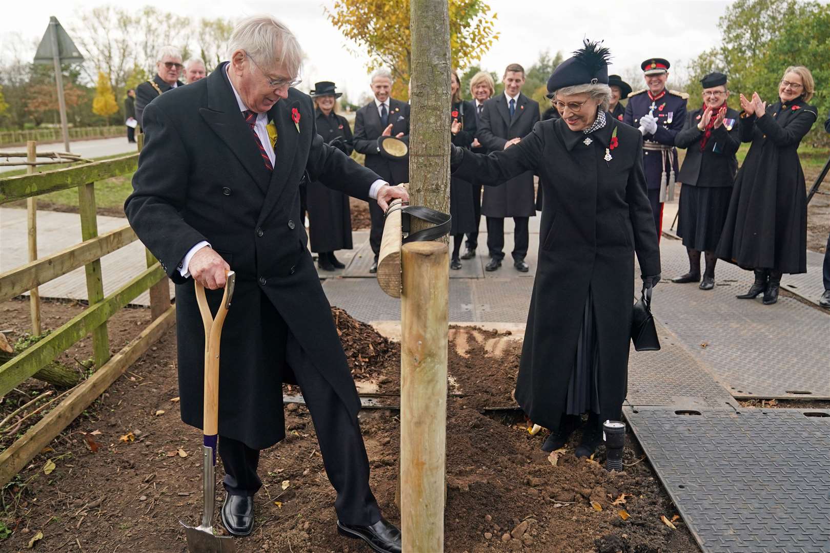 The Duke and Duchess of Gloucester plant a tree for the Queen’s Canopy (Jacob King/PA)