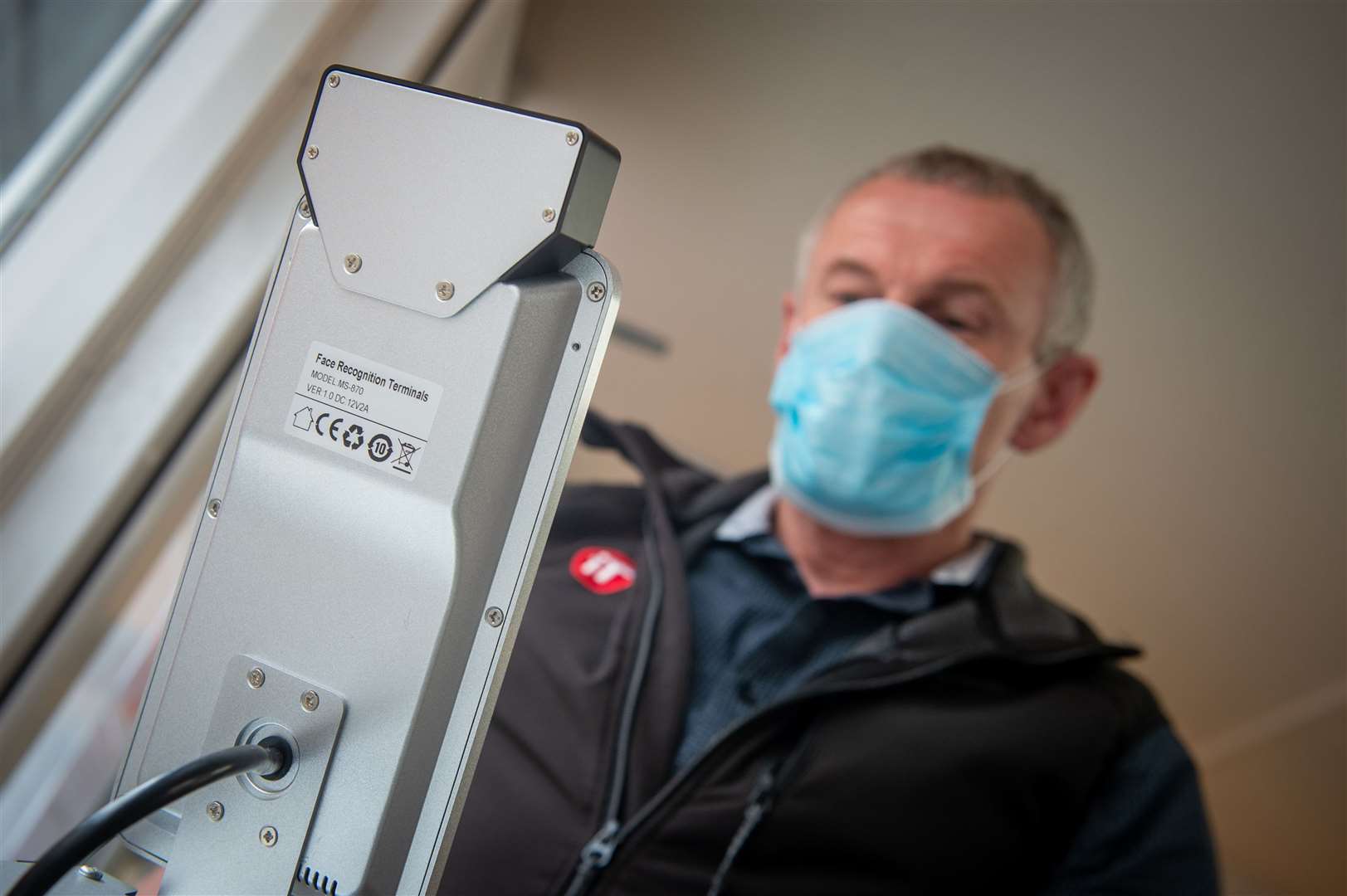 A heat detection booth at the firm's office measures people's temperatures. Picture: Callum Mackay.