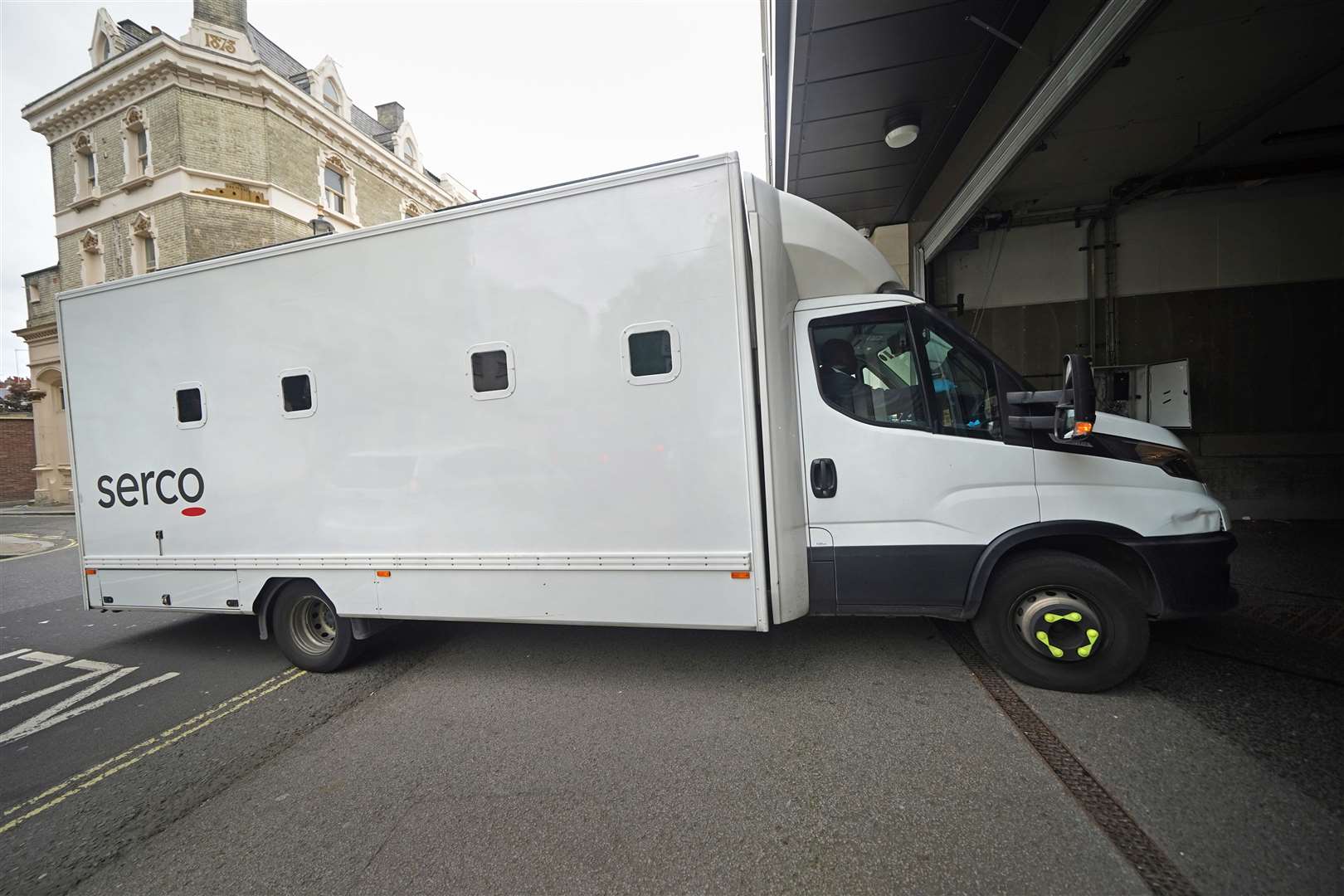 A custody van arrives at Westminster Magistrates’ Court, where three men are appearing charged under the National Security Act of assisting a foreign intelligence service in Hong Kong (Yui Mok/PA)